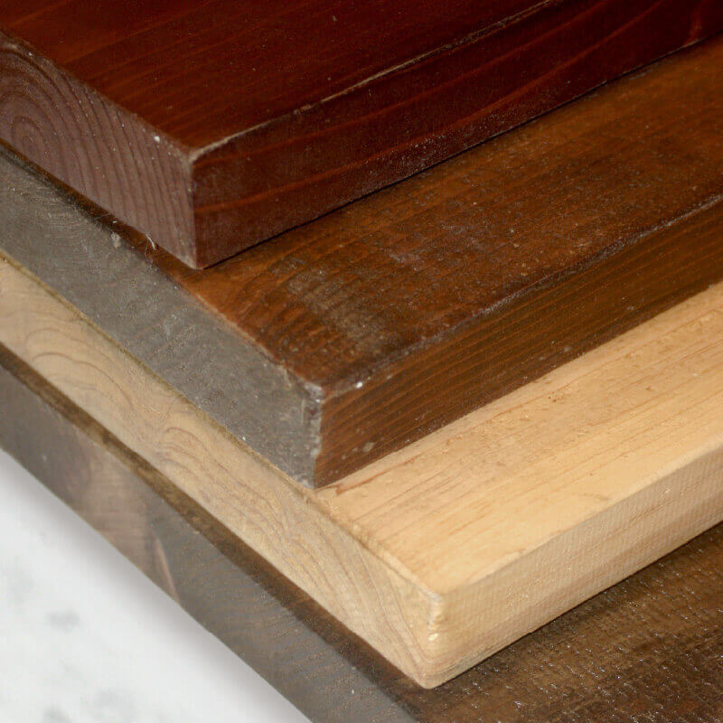sample corner view of 4 cedar boards, each with different stain finish